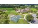 Aerial view of the community center with pool, recreation area, basketball court, and parking at 13806 Reindeer Cir, Hudson, FL 34669