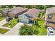 Beautiful aerial view of a well-maintained home with a two-car garage and landscaped yard at 13806 Reindeer Cir, Hudson, FL 34669