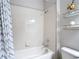 Close-up of bathroom featuring bathtub and shower with decorative shelves at 13806 Reindeer Cir, Hudson, FL 34669