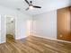 This bedroom features new flooring, an accent wall, and a walk-in closet at 13806 Reindeer Cir, Hudson, FL 34669