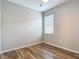 A bedroom featuring wood flooring, a window, and a ceiling fan at 13806 Reindeer Cir, Hudson, FL 34669