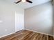 Bedroom featuring wood flooring and a closet with bi-fold doors at 13806 Reindeer Cir, Hudson, FL 34669