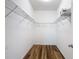 View of the closet that has wire shelving and new flooring at 13806 Reindeer Cir, Hudson, FL 34669
