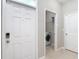 Functional laundry room setup, including washer, dryer, and built-in shelving at 13806 Reindeer Cir, Hudson, FL 34669