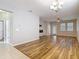 Living room featuring wood-style flooring, recessed lighting, fireplace, and light-colored walls at 13806 Reindeer Cir, Hudson, FL 34669