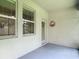 Enclosed patio with windows and a door, creating a relaxing outdoor space at 13806 Reindeer Cir, Hudson, FL 34669