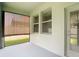 Screened patio featuring sun shades, offering a private outdoor retreat at 13806 Reindeer Cir, Hudson, FL 34669