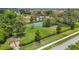 Community pickleball court surrounded by trees and green space has an adjacent parking lot at 13806 Reindeer Cir, Hudson, FL 34669
