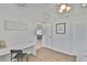 Bright bedroom with hard wood floors featuring an office desk and closet with doorway at 1426 Gerard Ln, Holiday, FL 34690