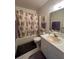 Cozy bathroom with tile floors, a single sink vanity, and a bathtub with a shower curtain at 1448 Highland Ridge Cir, Brandon, FL 33510