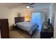 Bedroom featuring a large bed, closet, and sliding glass doors for natural light and fresh air at 1448 Highland Ridge Cir, Brandon, FL 33510