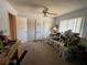 The bedroom has two closets, a ceiling fan, and a large window for great lighting and ventilation at 1448 Highland Ridge Cir, Brandon, FL 33510