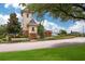 A community entrance tower and sign surrounded by landscaping and a well-manicured lawn at 15206 Merlinpark Pl, Lithia, FL 33547