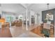 Spacious living room with tile floors, neutral decor, and abundant natural light at 15206 Merlinpark Pl, Lithia, FL 33547