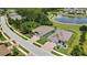 An aerial view showcases a lovely home, water view, and proximity to neighborhood amenities at 1846 Moorhen Way, Lutz, FL 33558
