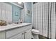 Bathroom featuring a marble vanity, toilet and bathtub with shower at 1846 Moorhen Way, Lutz, FL 33558