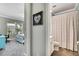 Bright bedroom with modern gray carpet flooring and a connecting ensuite bathroom at 1846 Moorhen Way, Lutz, FL 33558
