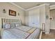 Bedroom featuring a cozy bed, closet, and bright lighting at 1846 Moorhen Way, Lutz, FL 33558