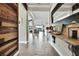 Spacious foyer leading to open-concept living area with wood-look tile flooring at 1846 Moorhen Way, Lutz, FL 33558