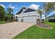 Charming single-story home featuring a three-car garage and well-maintained landscaping at 1846 Moorhen Way, Lutz, FL 33558