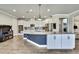 Open concept kitchen with an island, granite countertops, stainless steel appliances, and a mosaic backsplash at 1846 Moorhen Way, Lutz, FL 33558