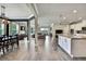 Open-concept living space with kitchen, dining area and living room at 1846 Moorhen Way, Lutz, FL 33558