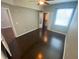 Open bedroom space with hardwood floors, a walk-in closet and a brightly lit window at 1910 E Palm Ave # 11322, Tampa, FL 33605