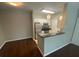 Eat in kitchen featuring stainless steel appliances, white cabinetry, and granite countertops at 1910 E Palm Ave # 11322, Tampa, FL 33605