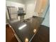 Eat in kitchen featuring stainless steel appliances, white cabinetry, and granite countertops at 1910 E Palm Ave # 11322, Tampa, FL 33605