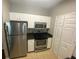 Modern kitchen with stainless steel appliances, granite countertops and ample storage space at 1910 E Palm Ave # 11322, Tampa, FL 33605