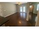 Spacious living room with hardwood floors, ceiling fan and access to a balcony at 1910 E Palm Ave # 11322, Tampa, FL 33605
