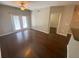Bright living room featuring hardwood floors, ceiling fan, and natural light from the doorway at 1910 E Palm Ave # 11322, Tampa, FL 33605