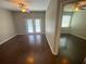 Bright living room with a ceiling fan, hardwood floors and access to a balcony at 1910 E Palm Ave # 11322, Tampa, FL 33605