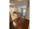 Spacious living and kitchen space featuring hardwood floors and modern lighting at 1910 E Palm Ave # 11322, Tampa, FL 33605