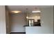 Open living space connecting to a functional kitchen with stainless steel appliances and a breakfast bar at 1910 E Palm Ave # 11322, Tampa, FL 33605