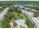 Community featuring a swimming pool, lake, community lawn, landscaping, and walking trails at 2314 Lake Woodberry Cir, Brandon, FL 33510