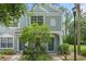 Charming townhouse featuring a well-manicured front yard and a freshly painted exterior in a tranquil community setting at 2314 Lake Woodberry Cir, Brandon, FL 33510