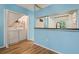 Convenient laundry closet with washer and dryer adjacent to kitchen area at 2314 Lake Woodberry Cir, Brandon, FL 33510