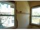 Sunlit bedroom with windows, ready for remodel, offering a bright space awaiting new finishes at 2355 Trelain S Dr, St Petersburg, FL 33712