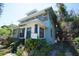 Features a two-story home with a charming entryway, and a partially-fenced front yard at 2355 Trelain S Dr, St Petersburg, FL 33712