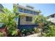 Showcases two-story home with stone facade and ample natural light through the windows at 2355 Trelain S Dr, St Petersburg, FL 33712