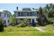 Inviting two-story home boasts classic architecture and a spacious front yard at 2355 Trelain S Dr, St Petersburg, FL 33712