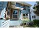 Exterior of a two-story light blue home featuring traditional architecture with window and back yard views at 2355 Trelain S Dr, St Petersburg, FL 33712
