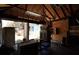 Garage interior view with wooden walls, debris, furniture and open doors at 2355 Trelain S Dr, St Petersburg, FL 33712