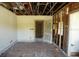 Large, unfinished living room ready for renovation, featuring an open design and exposed construction at 2355 Trelain S Dr, St Petersburg, FL 33712