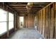 Unfinished living room featuring large windows and exposed framing, ready for renovation and customization at 2355 Trelain S Dr, St Petersburg, FL 33712