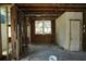 Room with exposed wood framing, a window, and doorway at 2355 Trelain S Dr, St Petersburg, FL 33712