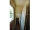 Interior with window, damaged walls, door, and exposed framing elements, revealing a renovation project in progress at 2355 Trelain S Dr, St Petersburg, FL 33712