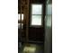 An empty room with exposed wood, a window, and a partly disassembled wall at 2355 Trelain S Dr, St Petersburg, FL 33712