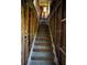 Wooden staircase with exposed framing and natural light, ready for renovation and revitalization at 2355 Trelain S Dr, St Petersburg, FL 33712